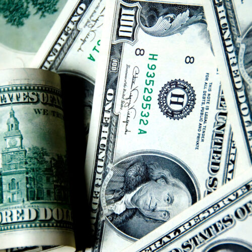 Money background of one hundred dollars $100 bills in US currency